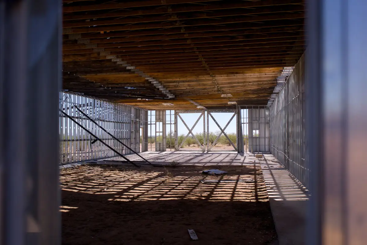 Metal framing and wooden ceiling structure in a commercial construction site