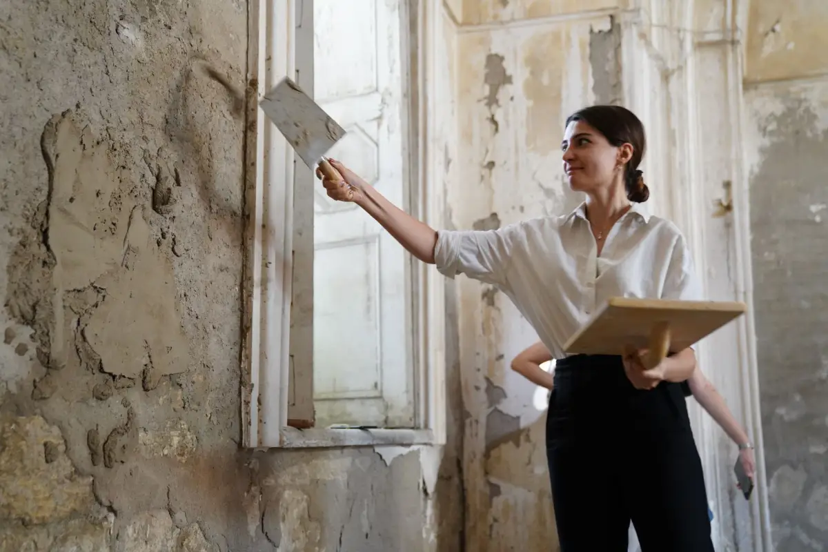 Applying plaster repair in an older home