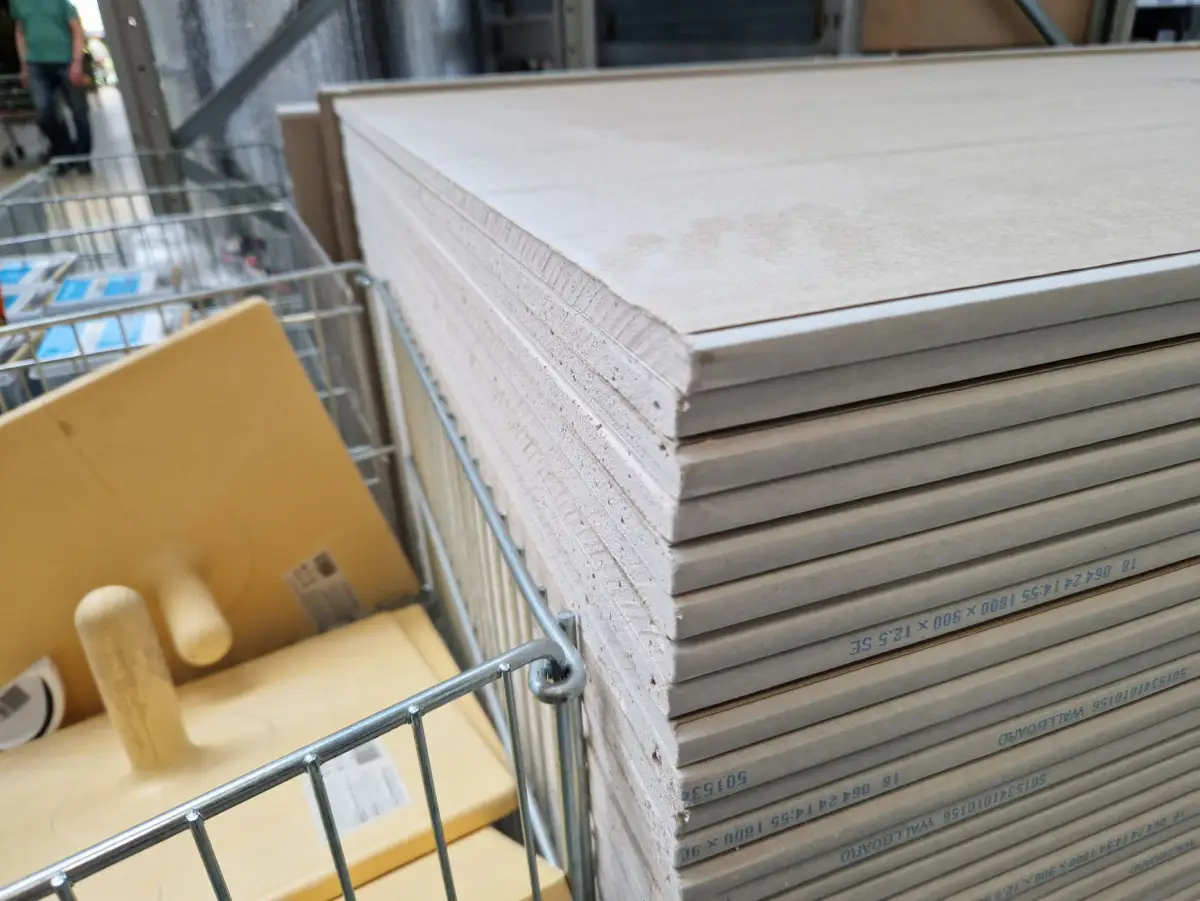 Drywall panels stacked and ready for a commercial tenant build-out