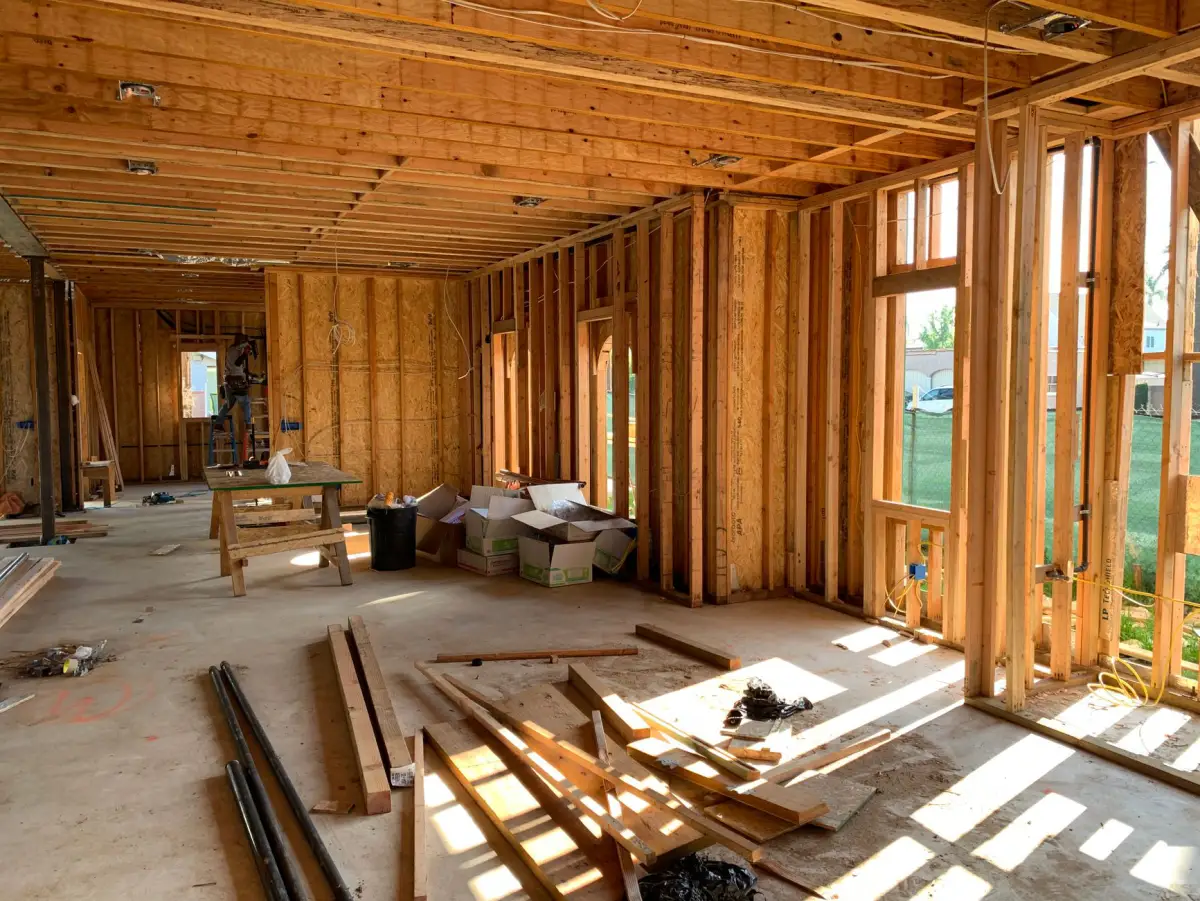 Sunlit interior wood framing during a tenant build-out partition wall