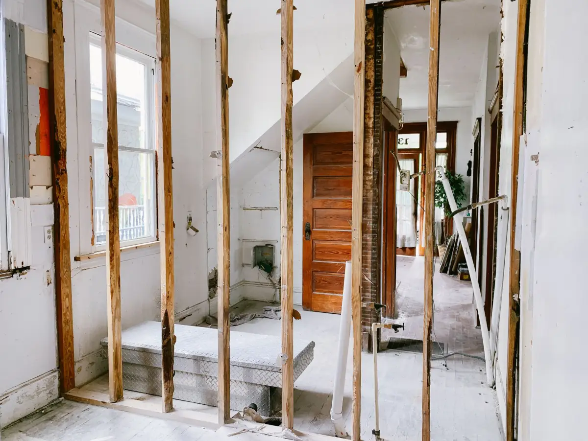 Exposed framing during a water-damaged drywall replacement