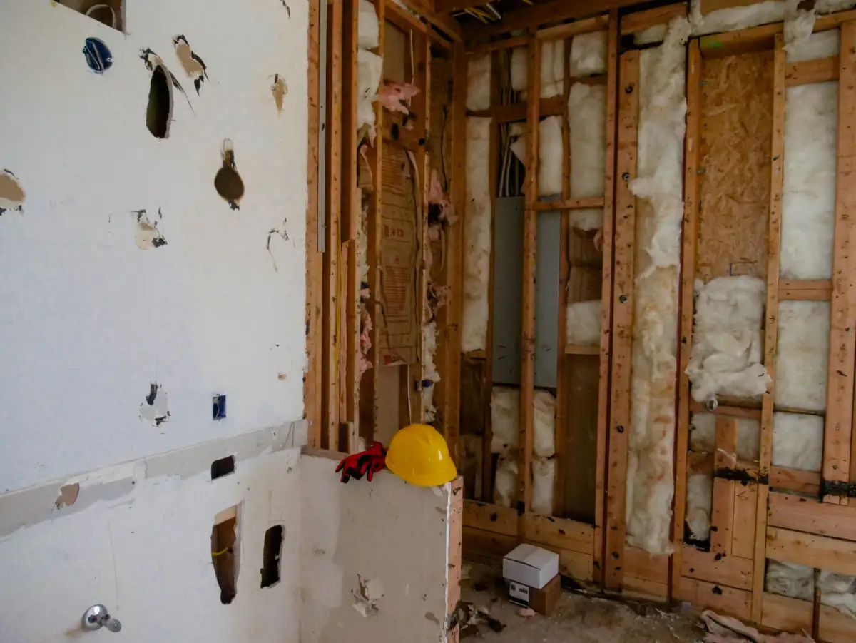 Interior wall opened up during water-damaged drywall removal